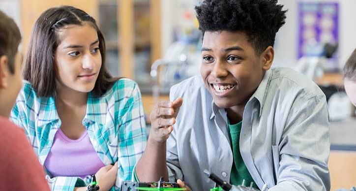 Students discuss in a science class