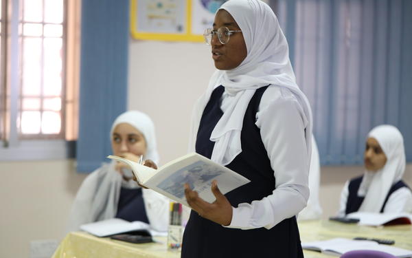 Students holding a book