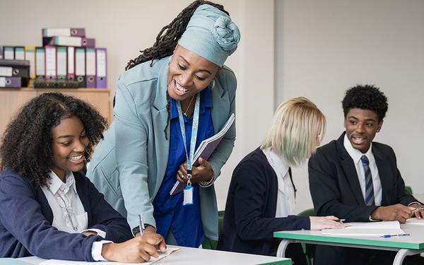 Image of children and a teacher in a classroom