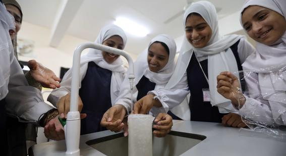 omani students doing a science experiment