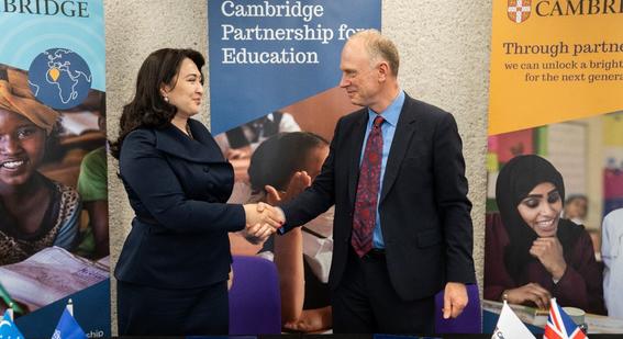 Two people shake hands
