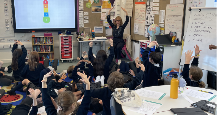 Sarah Nelson teaches a wellbeing activity at the University of Cambridge Primary School